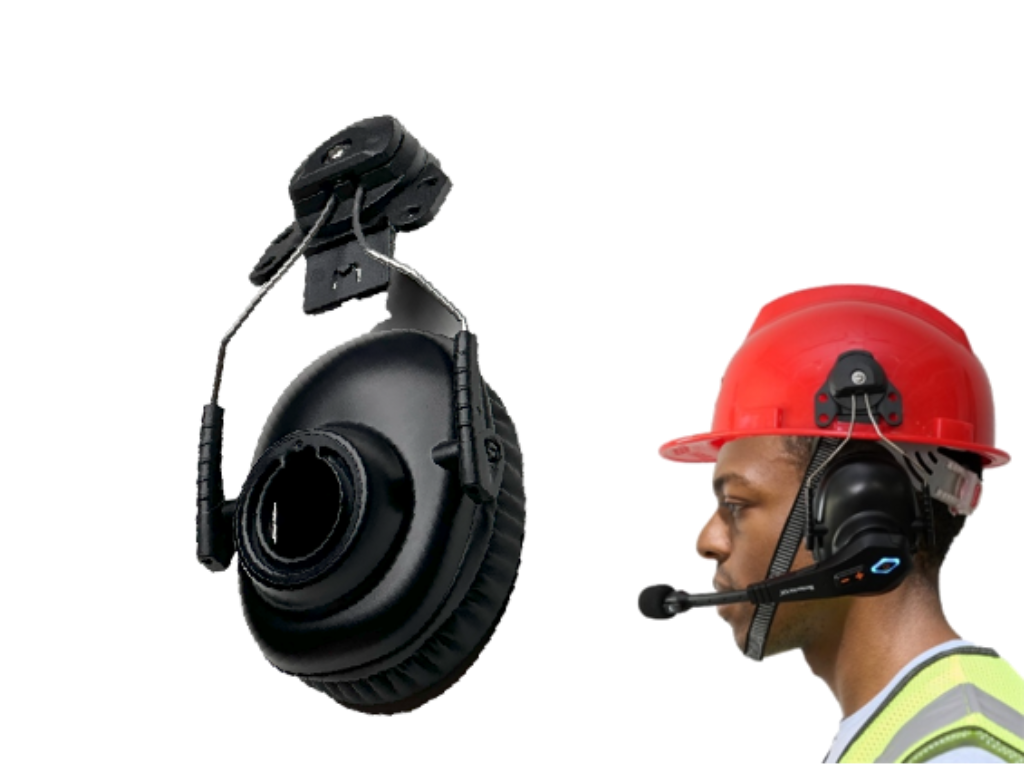 Worker using CNH3 with a safety helmet in an industrial setting